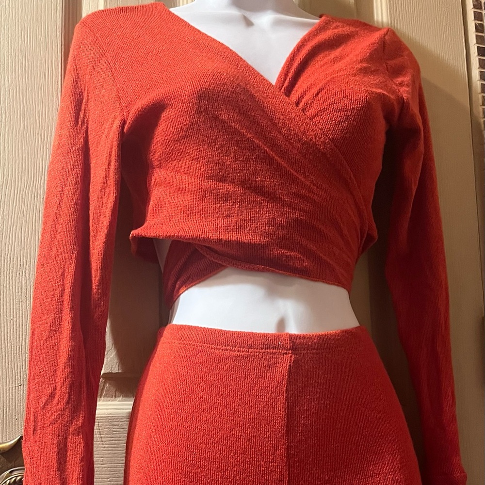 Two piece orange stretch, sarong top with bell sleeves & bell bottom pants